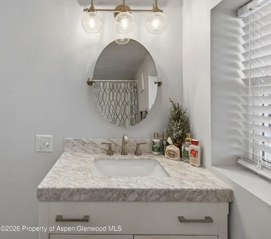 a kitchen with stainless steel appliances granite countertop a refrigerator sink and stove