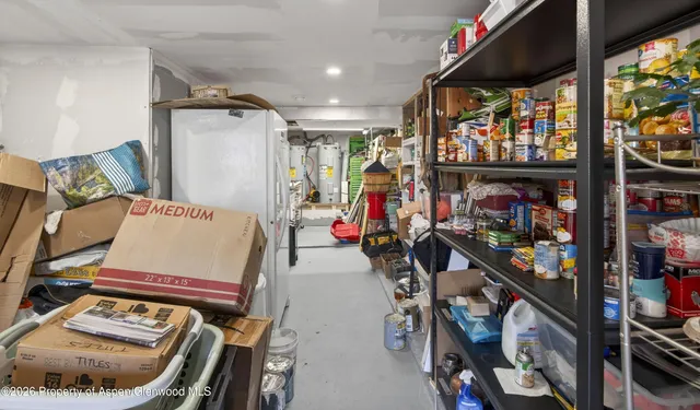 a view of a large building with mountains in the background