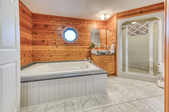 a view of a bathroom with a sink and a mirror