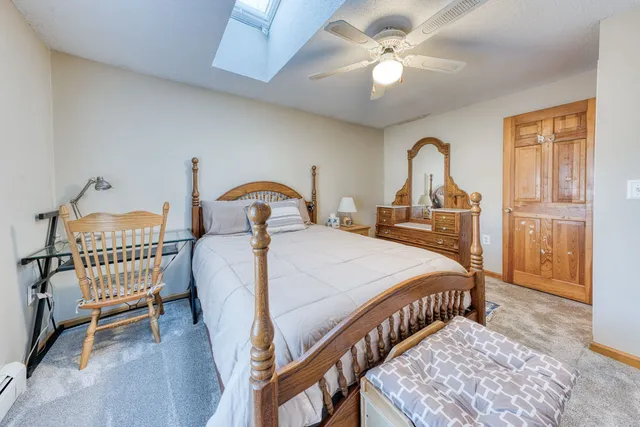 a bedroom with bed and a window