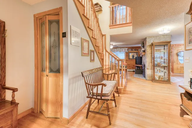 a view of a hallway with furniture and staircase