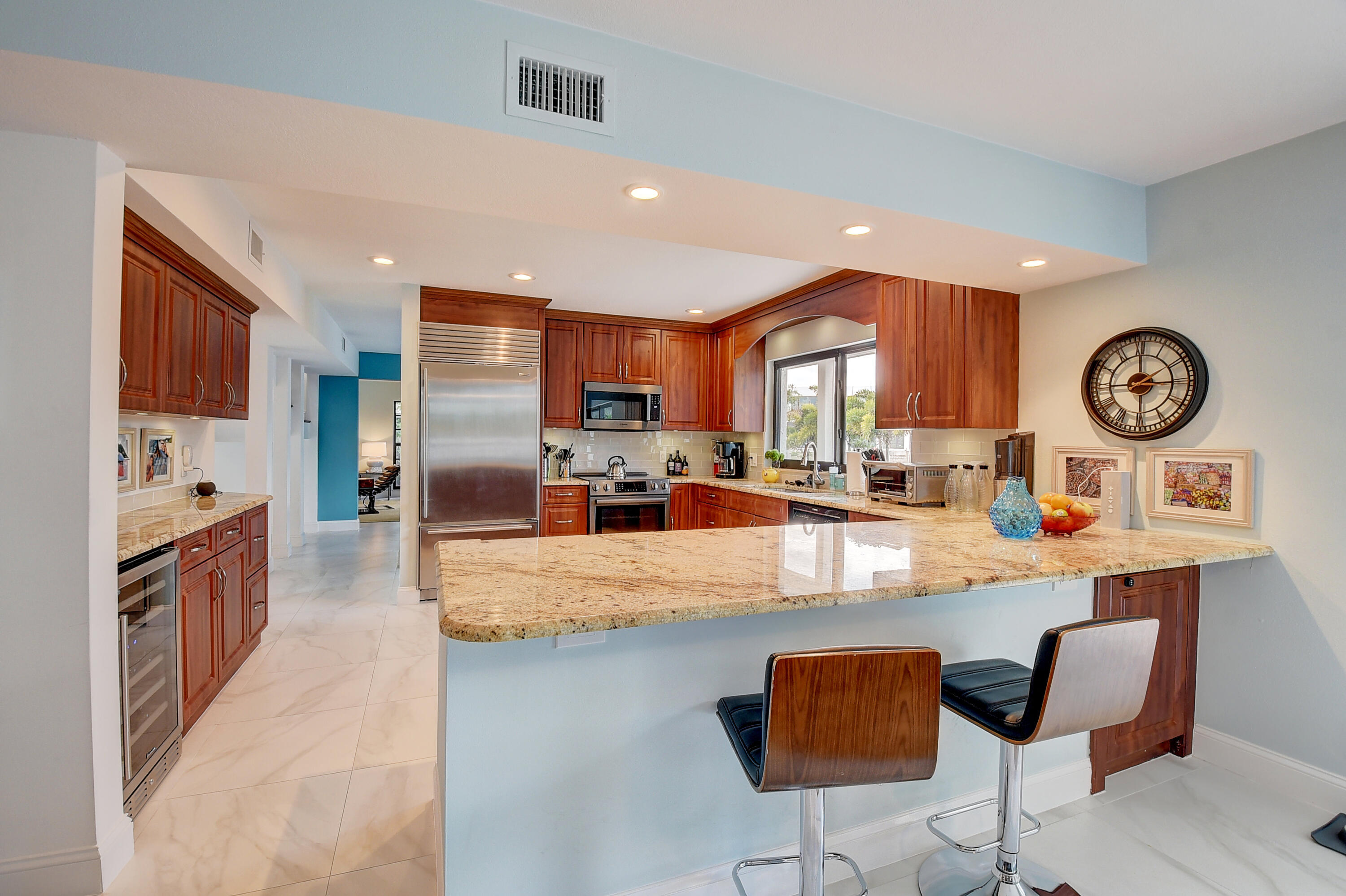 399 Southwest 15th Street Boca Raton, FL 33432 - Photo 20 of 49 a large kitchen with stainless steel appliances granite countertop a stove and a refrigerator