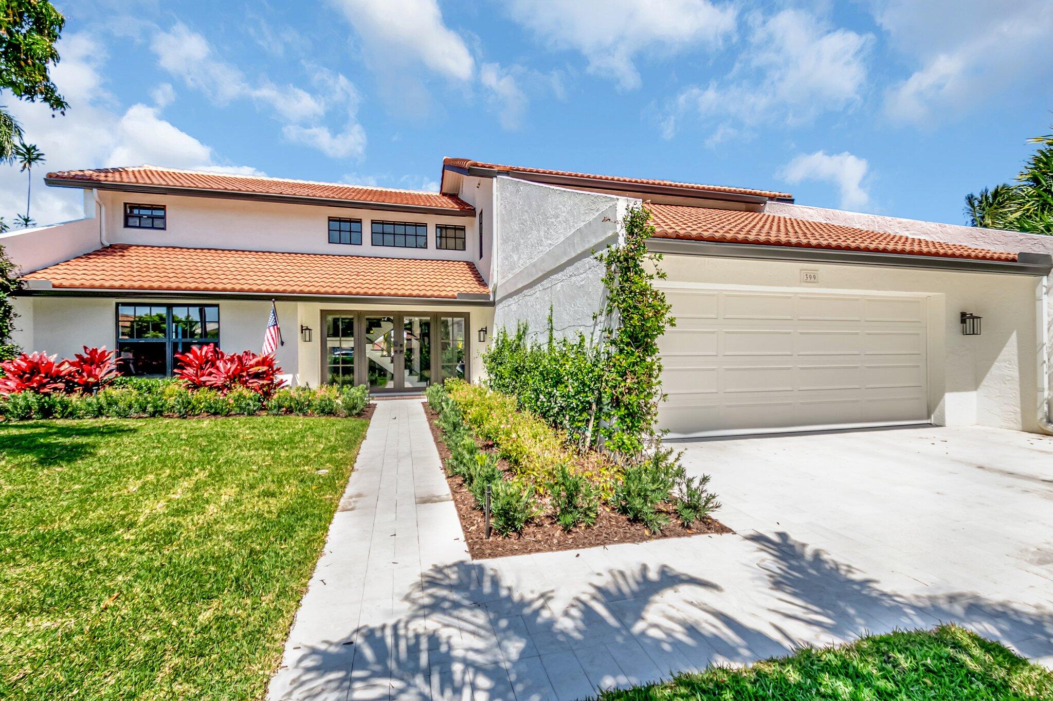 399 Southwest 15th Street Boca Raton, FL 33432 - Photo 2 of 49 a view of a house with a small yard and a large tree