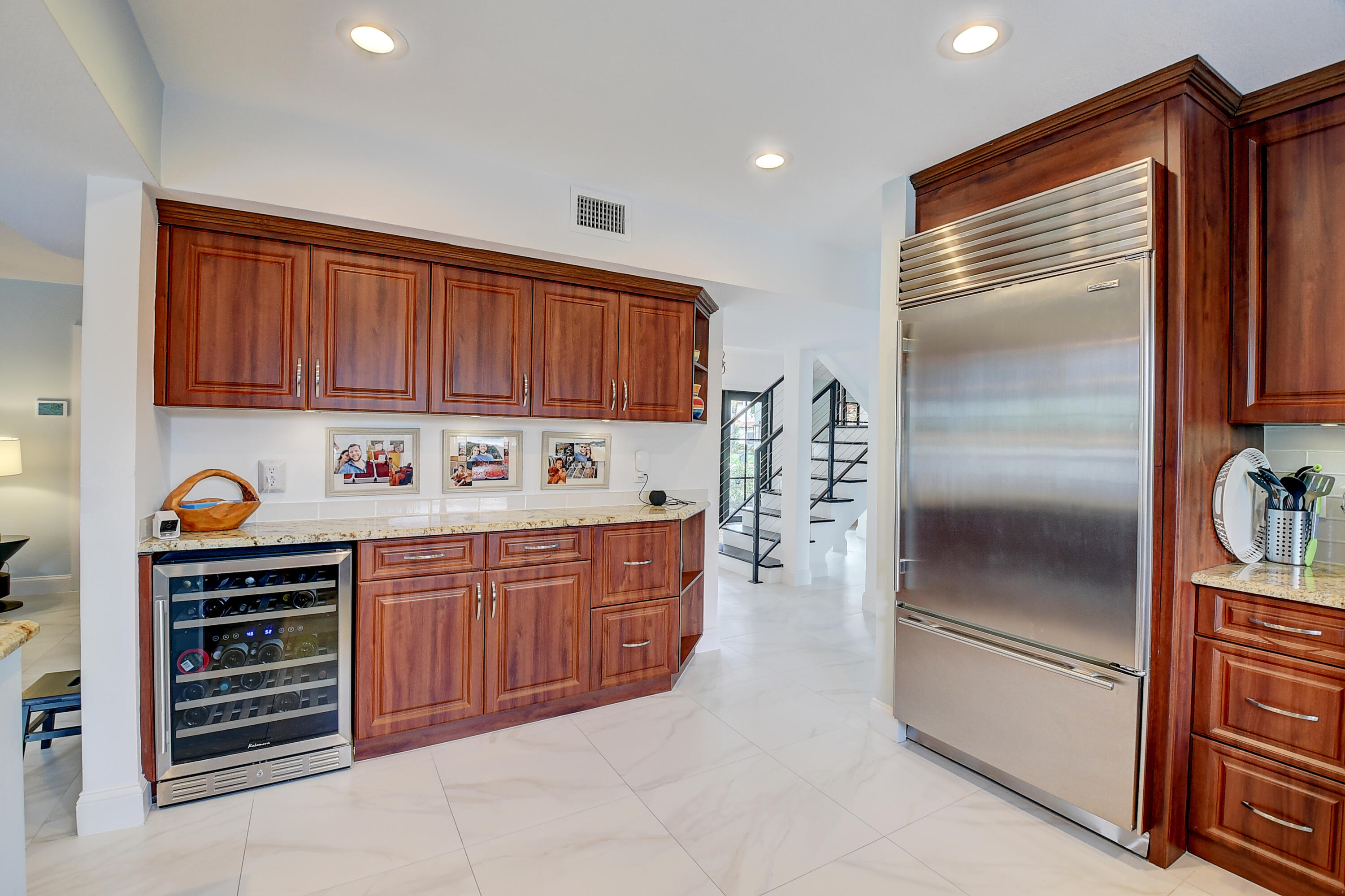 399 Southwest 15th Street Boca Raton, FL 33432 - Photo 22 of 49 a kitchen with stainless steel appliances granite countertop a refrigerator and a stove