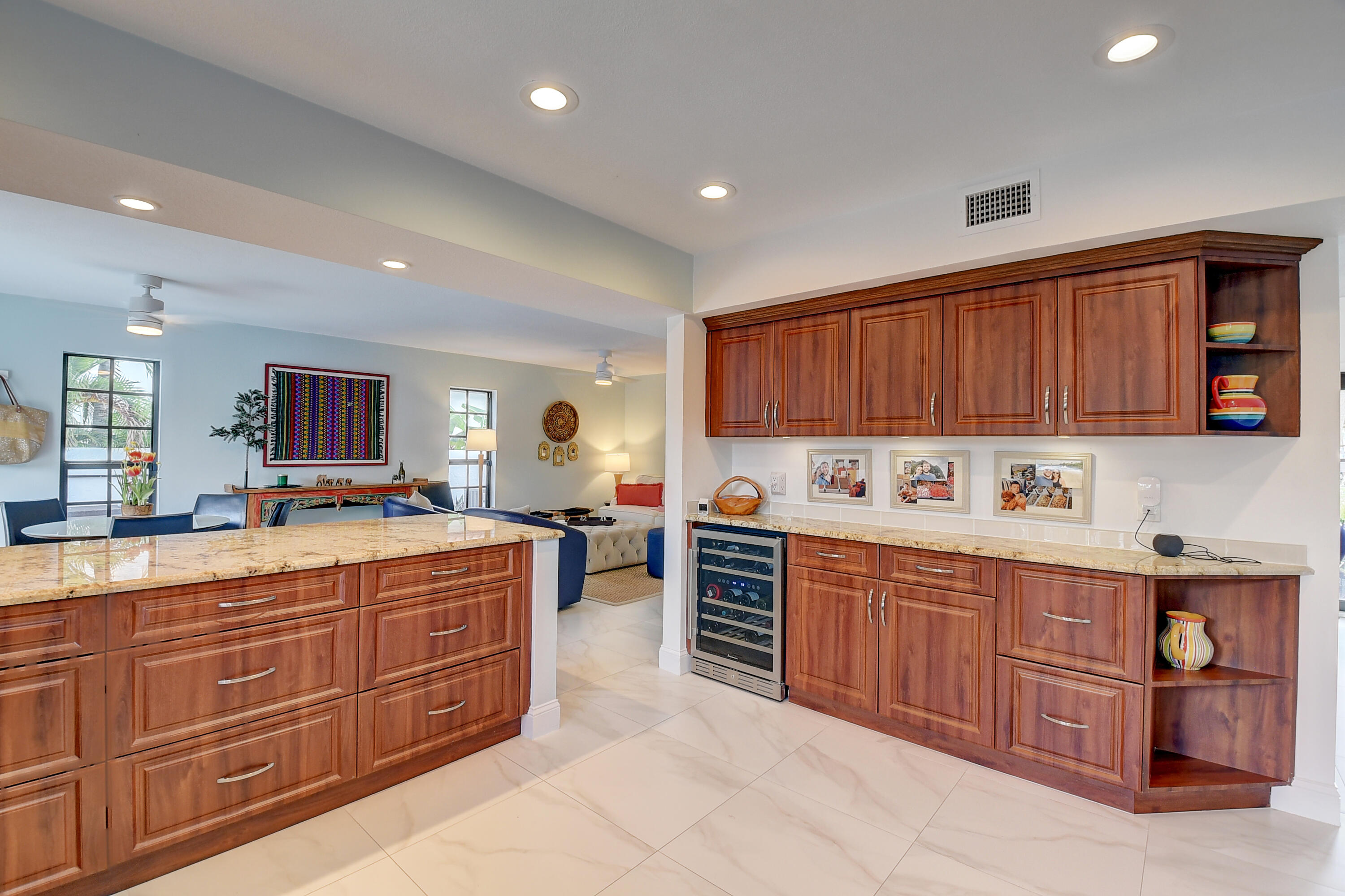 399 Southwest 15th Street Boca Raton, FL 33432 - Photo 23 of 49 a large kitchen with stainless steel appliances wooden cabinets and a stove top oven