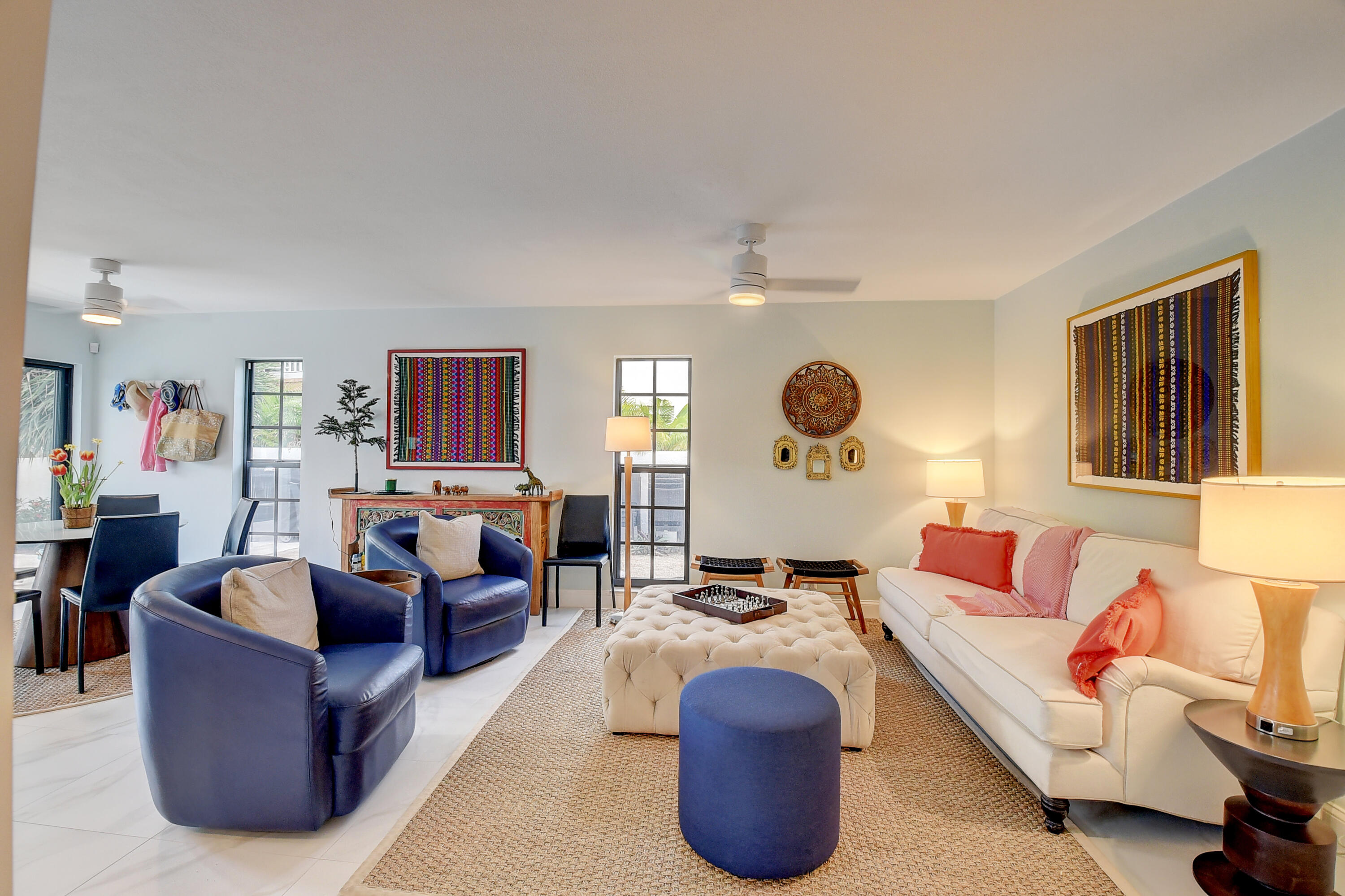 399 Southwest 15th Street Boca Raton, FL 33432 - Photo 25 of 49 a living room with furniture a rug and a lamp