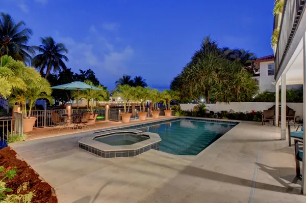 a view of a swimming pool with a patio
