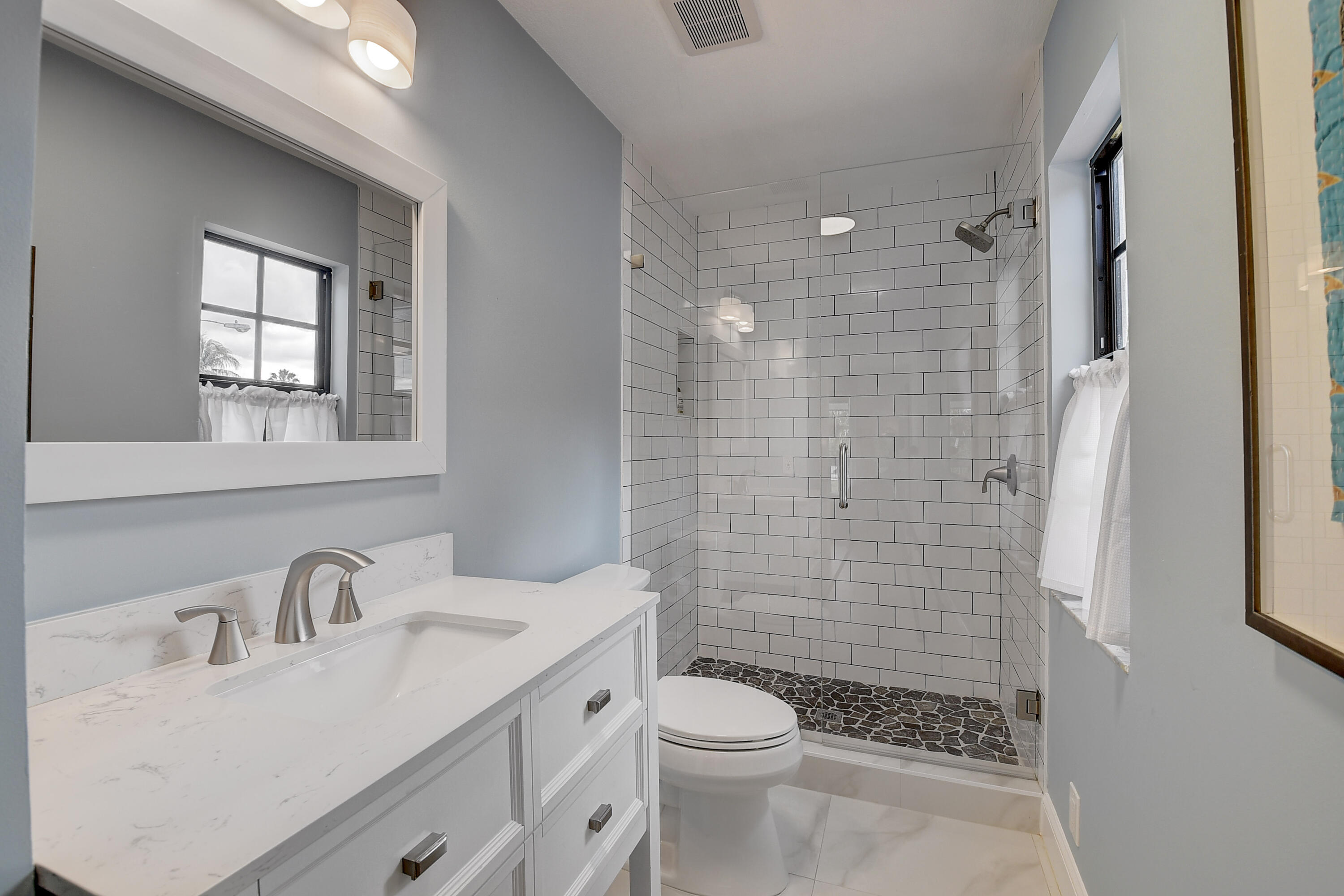 399 Southwest 15th Street Boca Raton, FL 33432 - Photo 35 of 49 a bathroom with a sink a toilet and shower