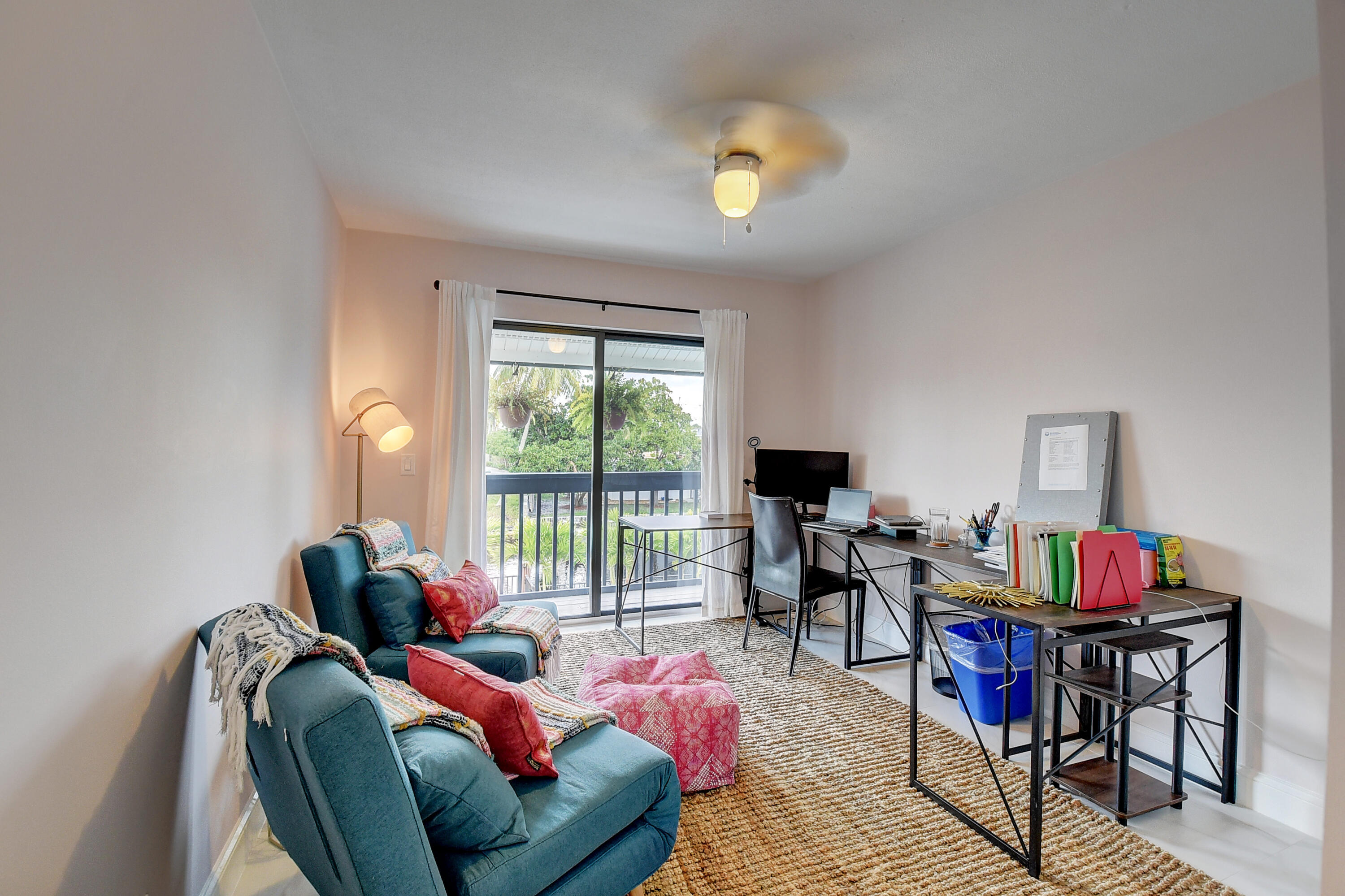 399 Southwest 15th Street Boca Raton, FL 33432 - Photo 36 of 49 a living room with furniture and a large window