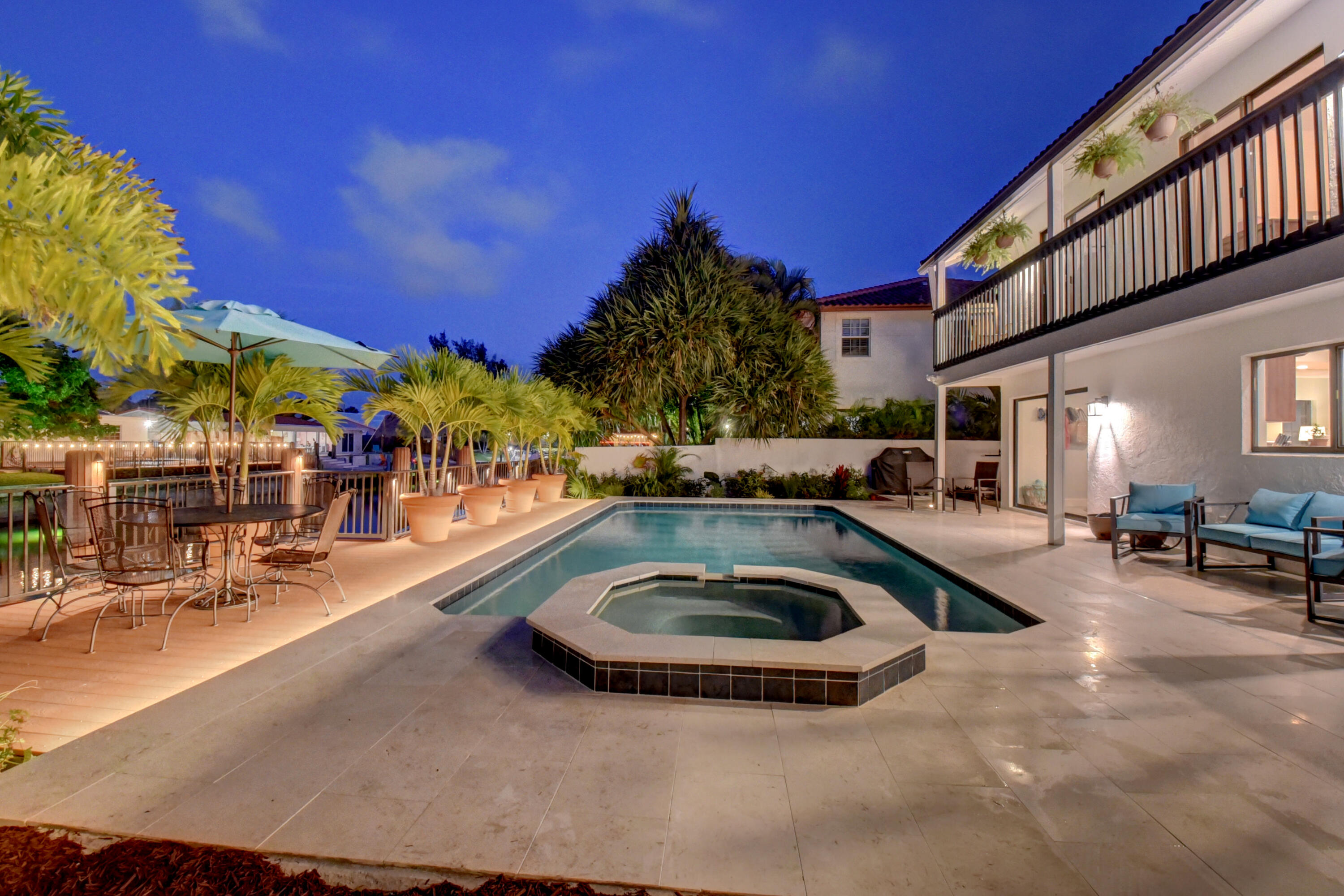 399 Southwest 15th Street Boca Raton, FL 33432 - Photo 4 of 49 a view of a swimming pool with outdoor seating
