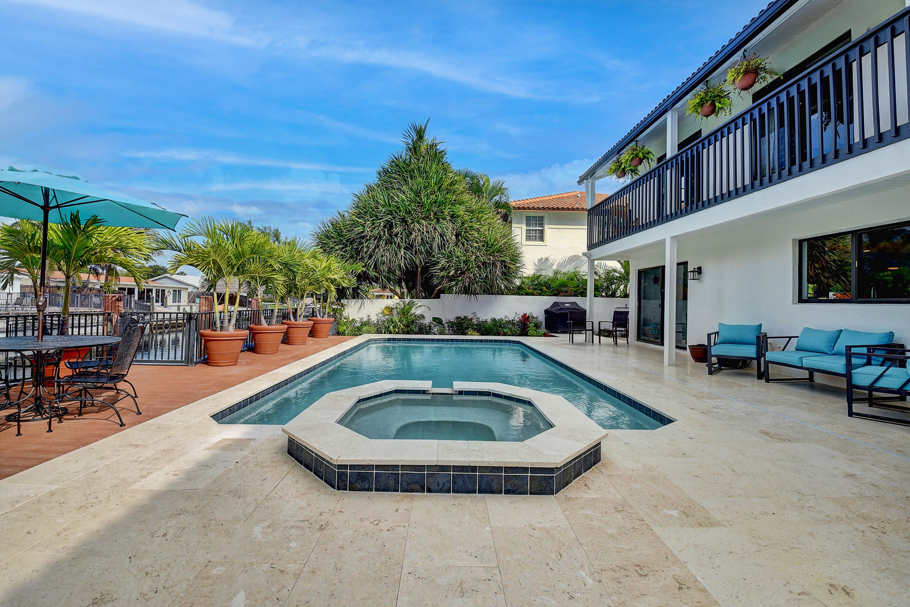 399 Southwest 15th Street Boca Raton, FL 33432 - Photo 46 of 49 a swimming pool with outdoor seating and yard