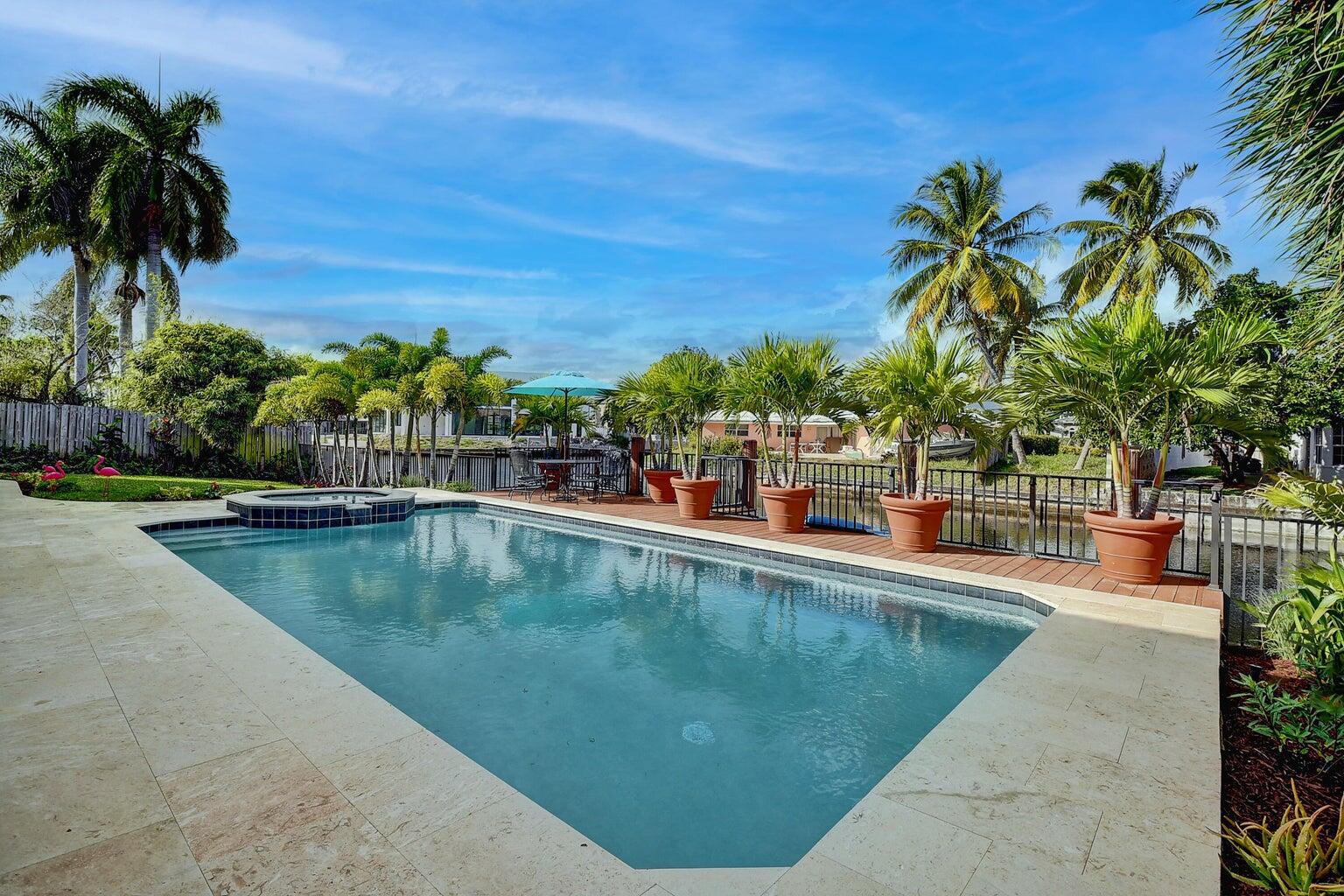 399 Southwest 15th Street Boca Raton, FL 33432 - Photo 47 of 49 a view of swimming pool with a table and chairs