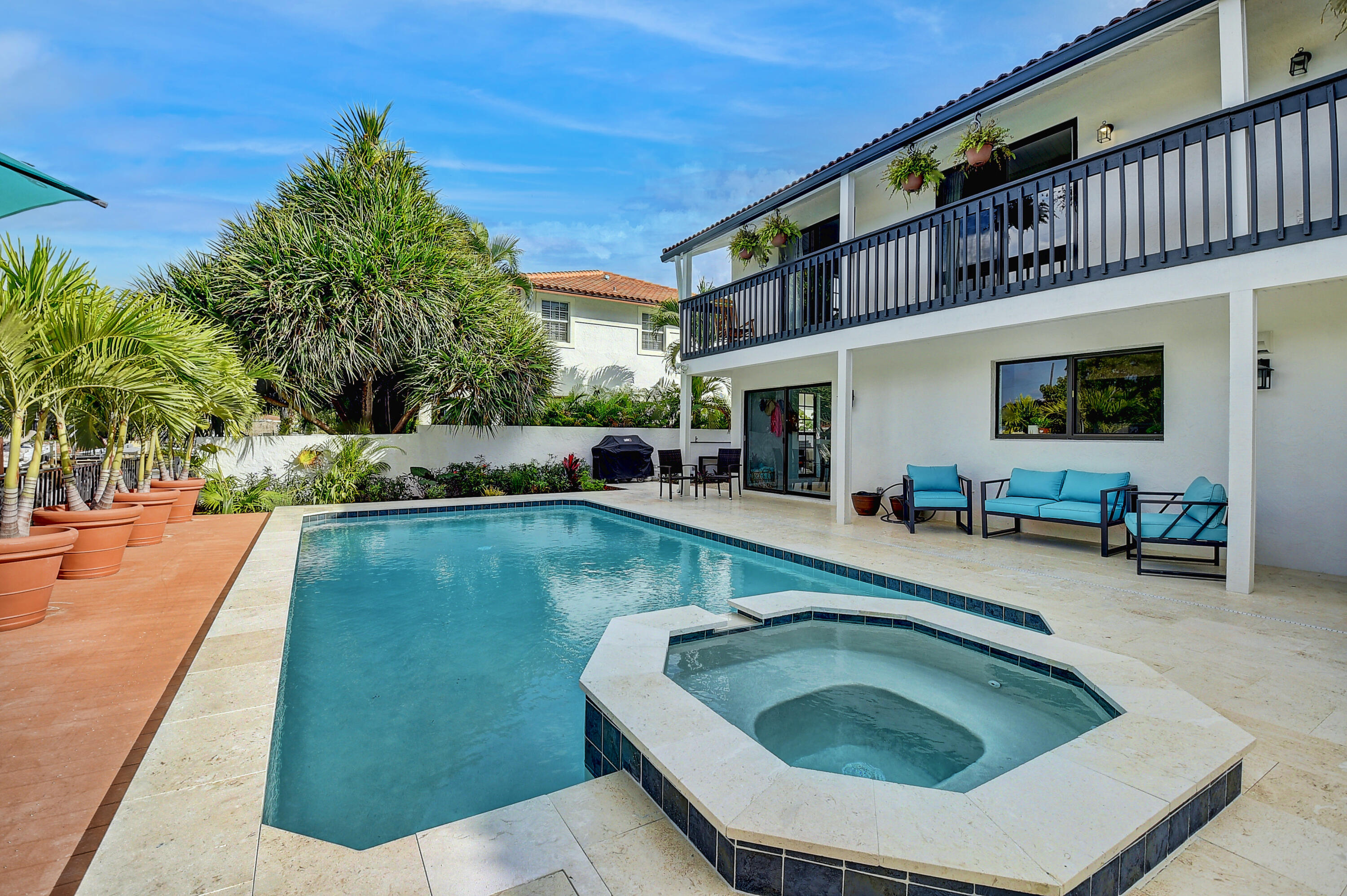 399 Southwest 15th Street Boca Raton, FL 33432 - Photo 49 of 49 a swimming pool with outdoor seating and yard