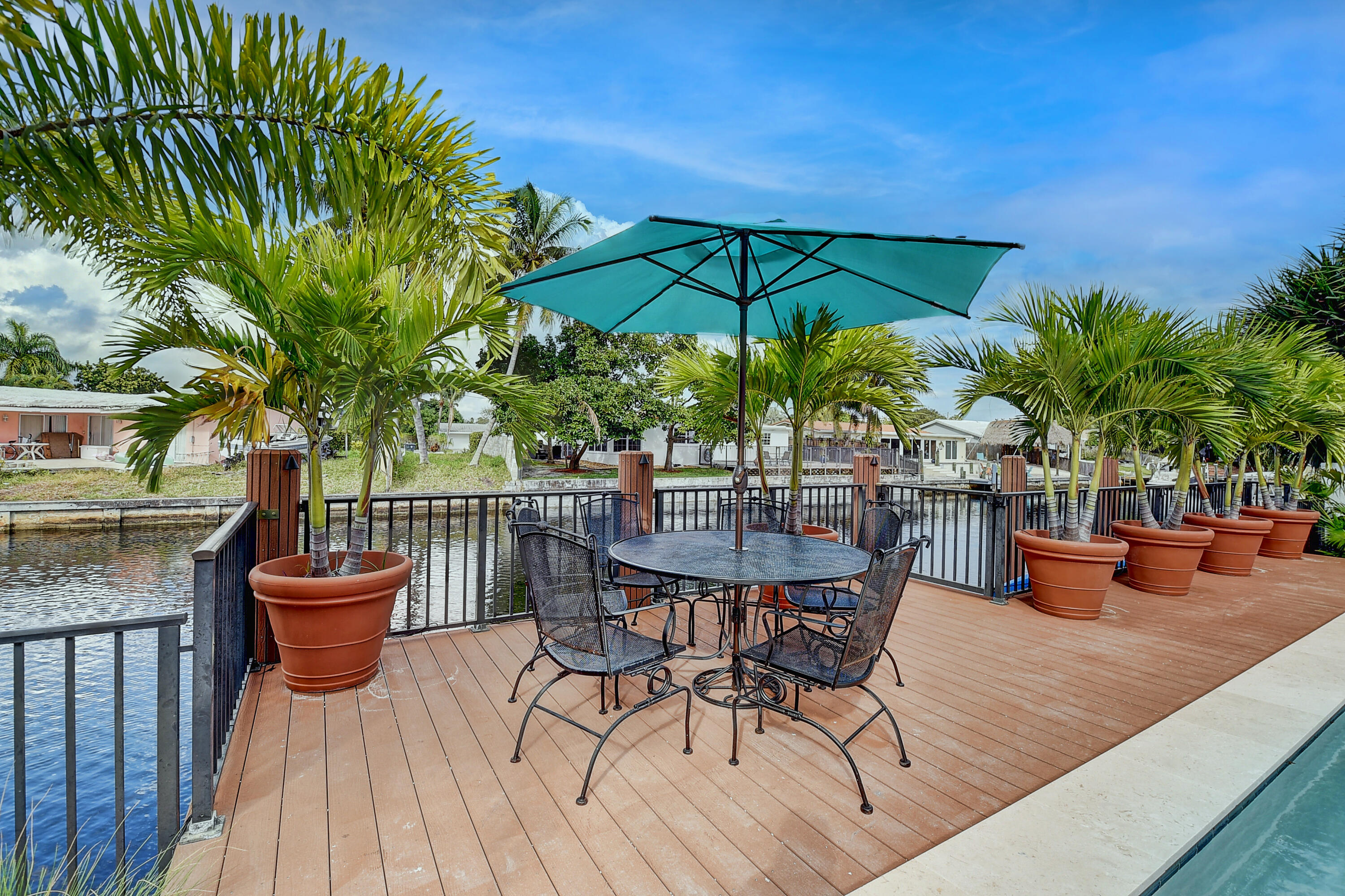 399 Southwest 15th Street Boca Raton, FL 33432 - Photo 7 of 49 a view of a chair and tables in the patio