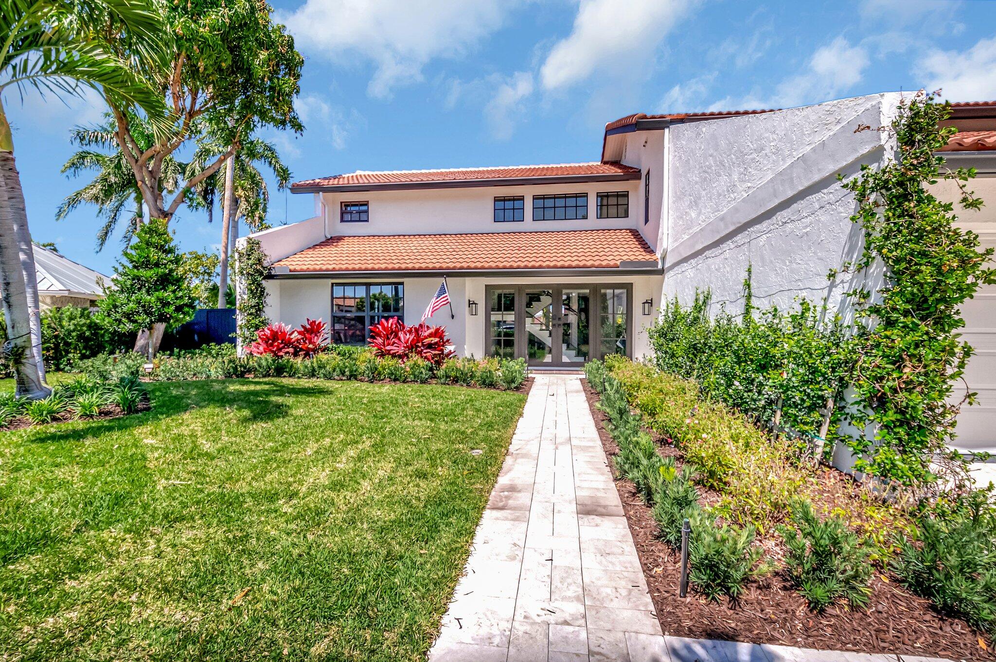 399 Southwest 15th Street Boca Raton, FL 33432 - Photo 8 of 49 a front view of a multi story residential apartment buildings