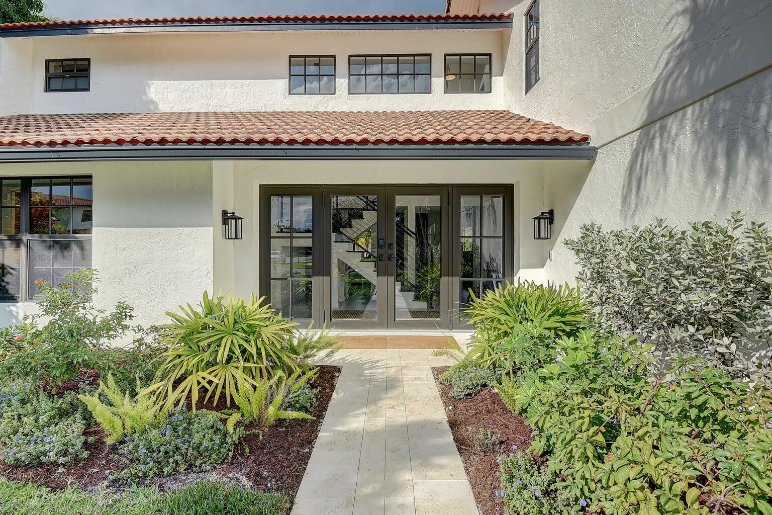 399 Southwest 15th Street Boca Raton, FL 33432 - Photo 10 of 49 a front view of a house