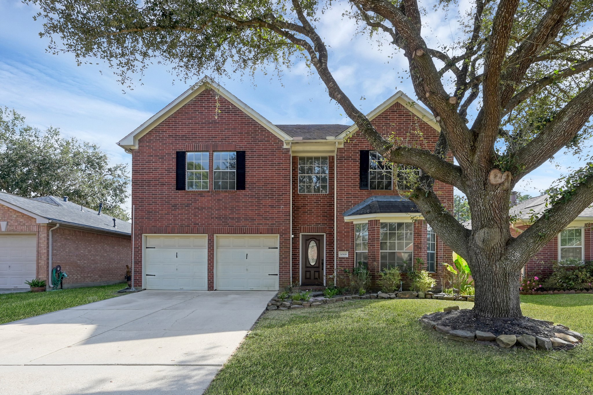 30818 Trinket Drive Spring, TX 77386 - Photo 1 of 29 a front view of a house with a garden