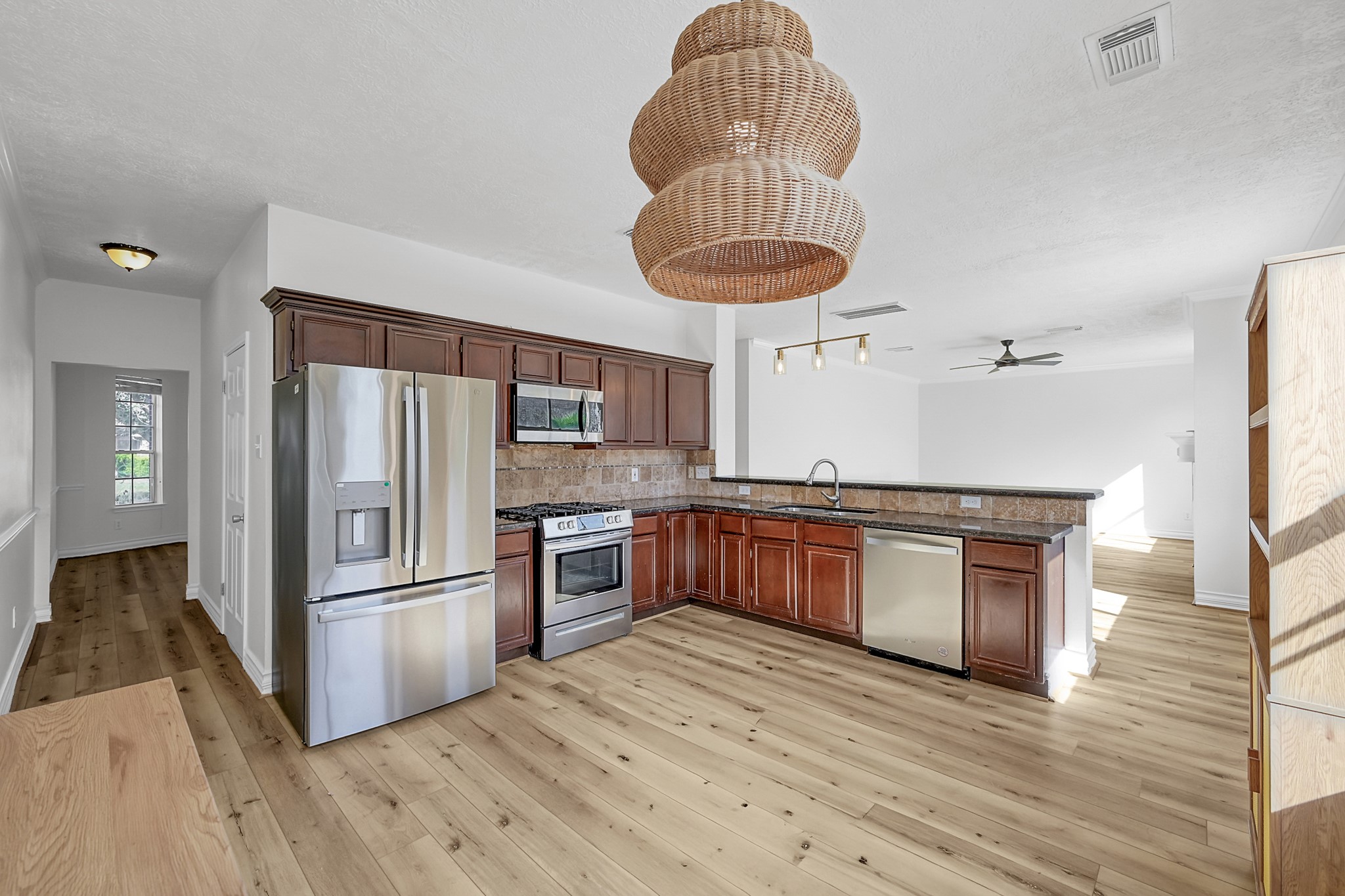 30818 Trinket Drive Spring, TX 77386 - Photo 11 of 29 a kitchen with stainless steel appliances granite countertop a stove refrigerator and microwave