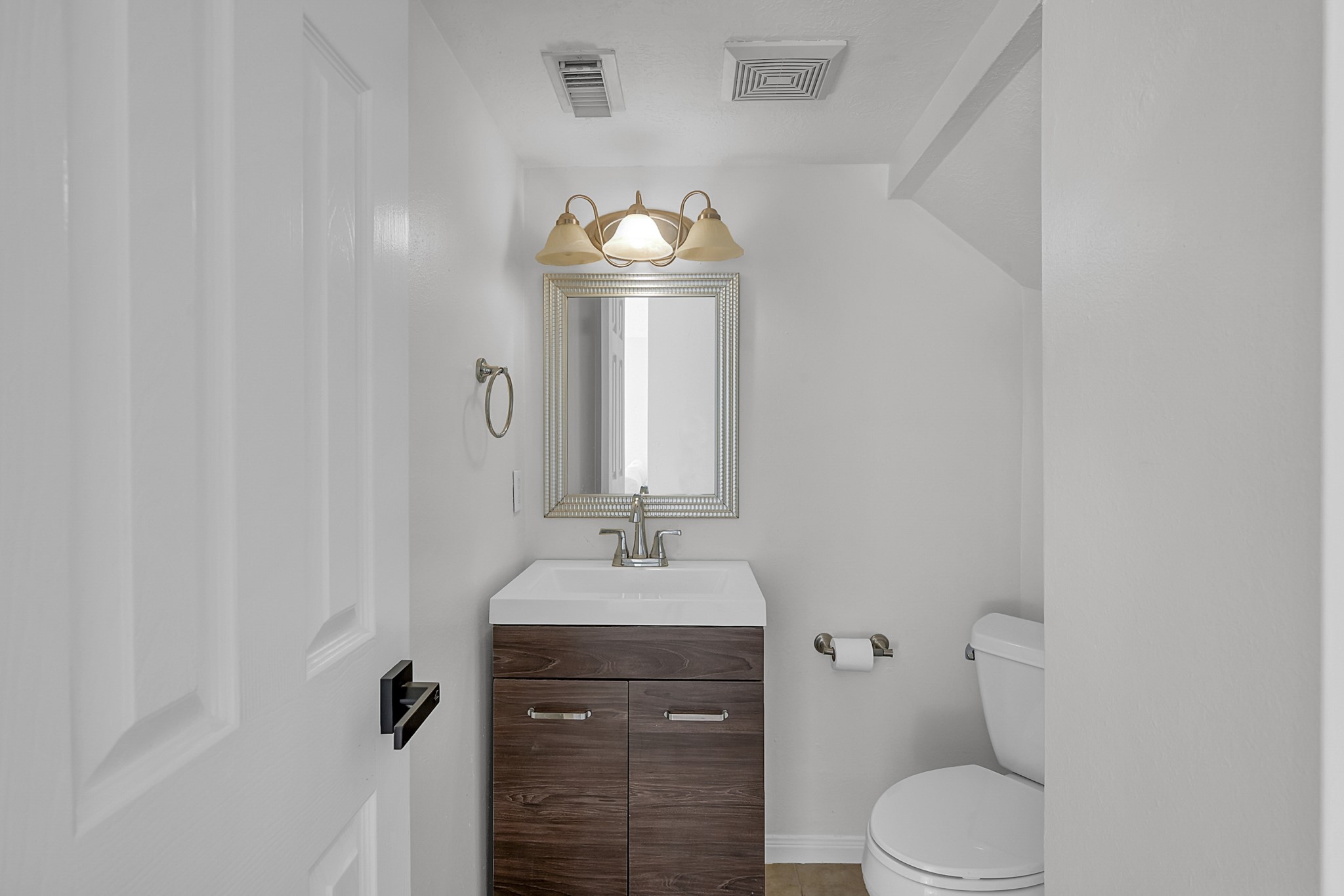 30818 Trinket Drive Spring, TX 77386 - Photo 17 of 29 a bathroom with a sink vanity mirror and toilet