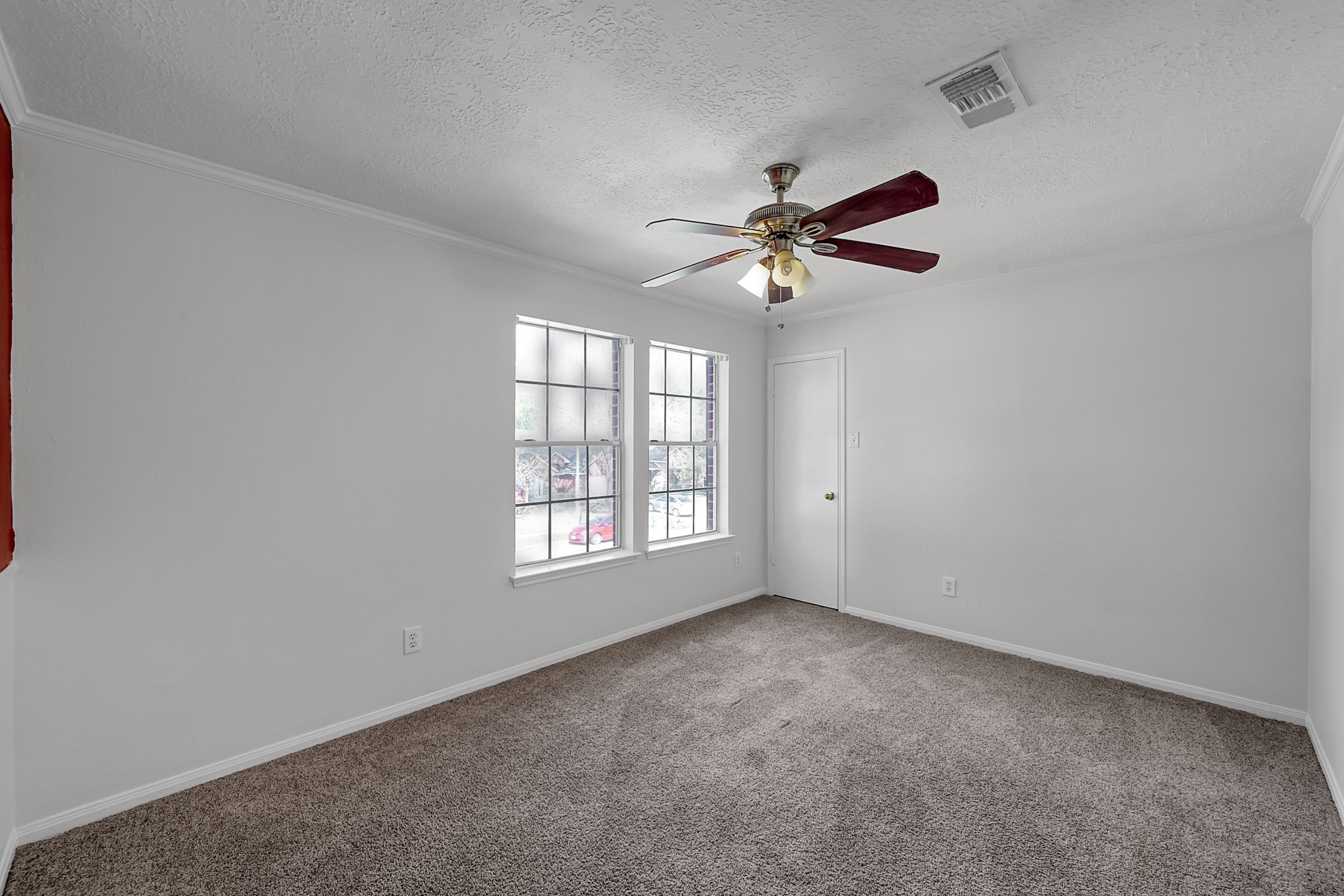 30818 Trinket Drive Spring, TX 77386 - Photo 23 of 29 an empty room with chandelier fan and windows