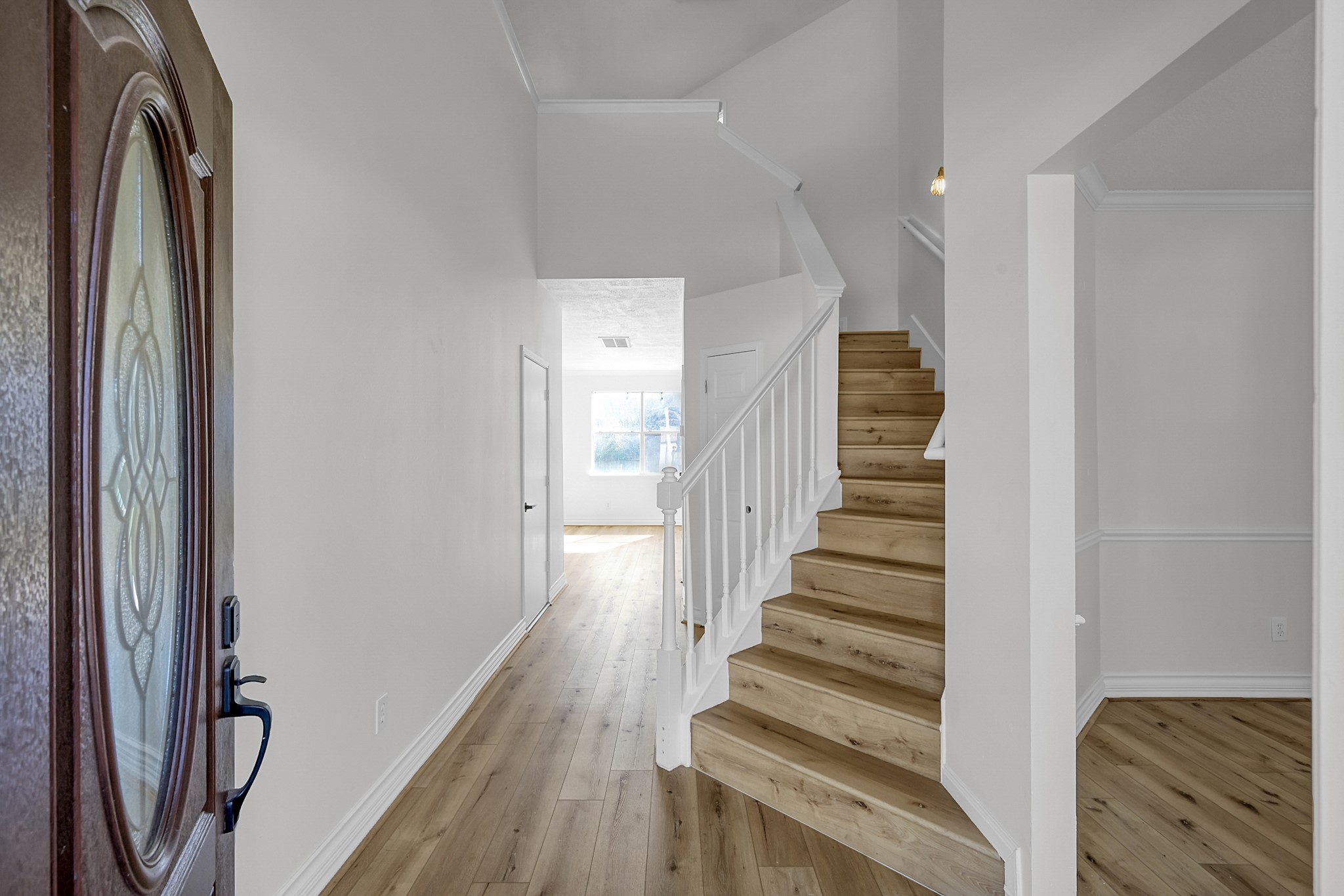 30818 Trinket Drive Spring, TX 77386 - Photo 3 of 29 a view of a hallway with wooden floor and entryway