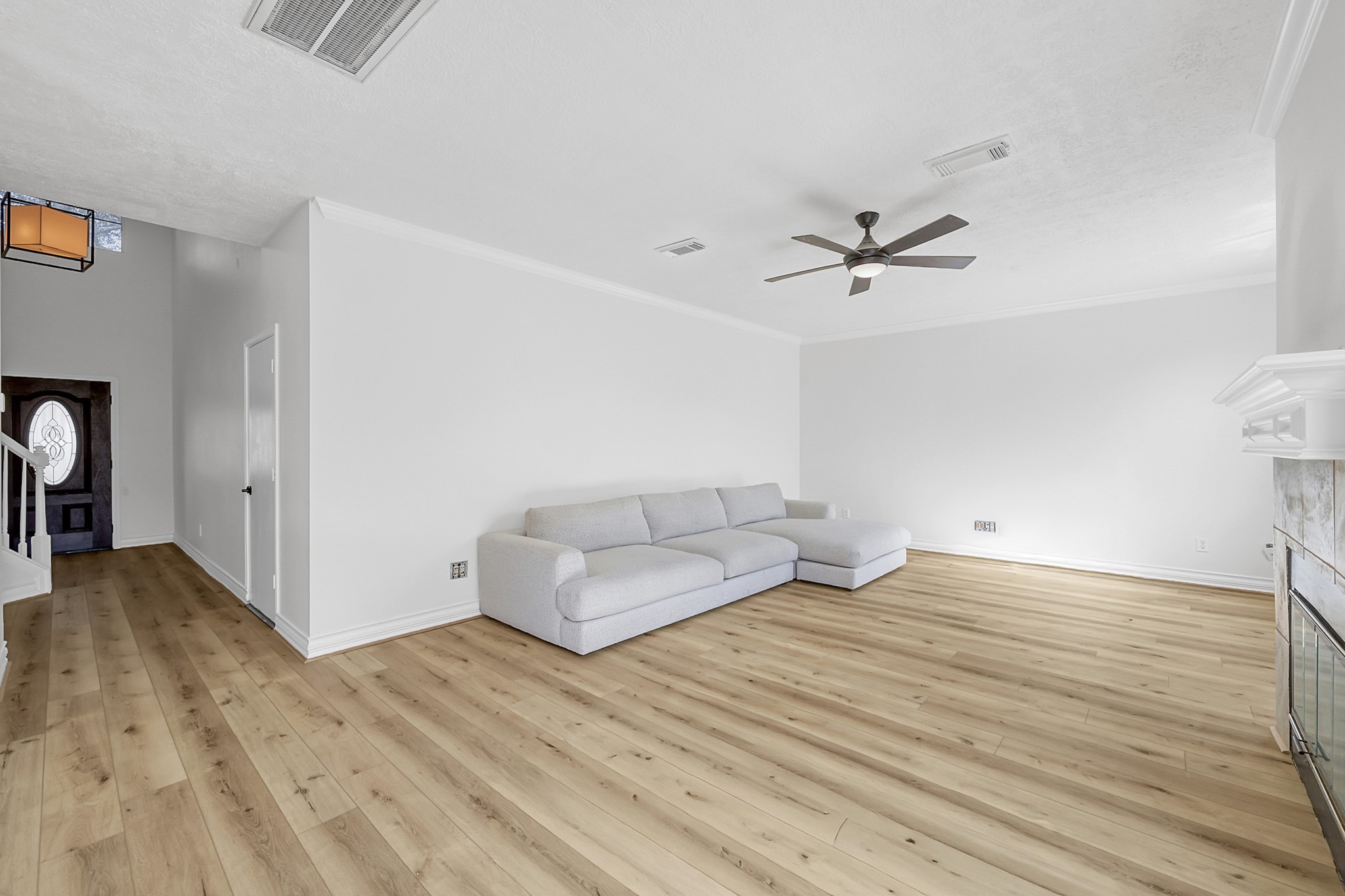 30818 Trinket Drive Spring, TX 77386 - Photo 9 of 29 a view of a livingroom with a hardwood floor and a ceiling fan