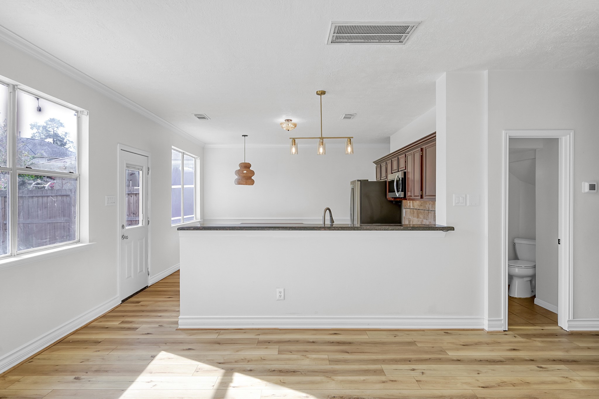 30818 Trinket Drive Spring, TX 77386 - Photo 10 of 29 a view of a livingroom with wooden floor and staircase