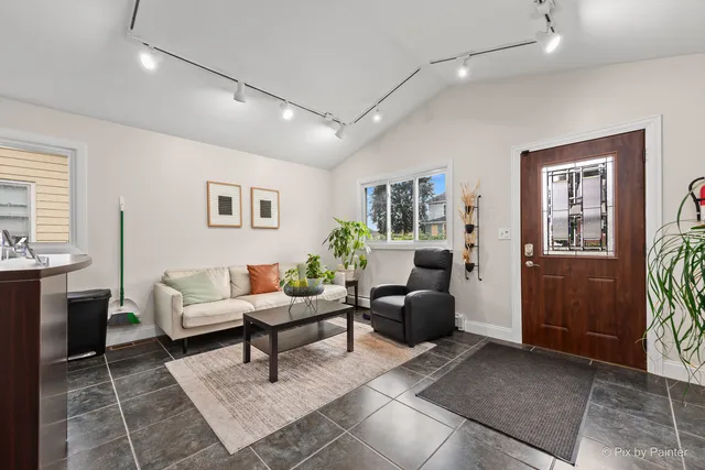 a living room with furniture and a rug