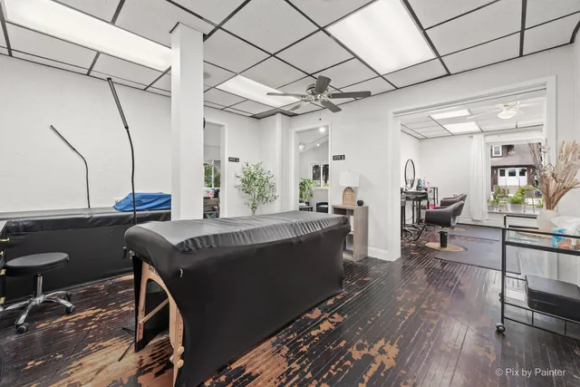 a living room with furniture a dining table and a piano table
