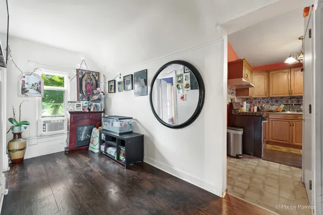 a bedroom with a bed and a tv