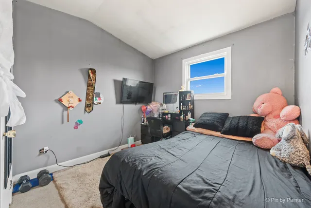 a kitchen with stainless steel appliances kitchen island granite countertop a refrigerator and microwave