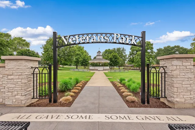 a view of backyard with swimming pool and outdoor seating
