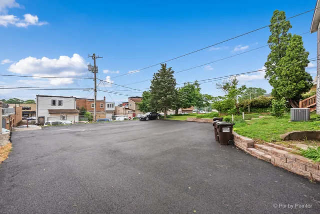 a view of a street with a park