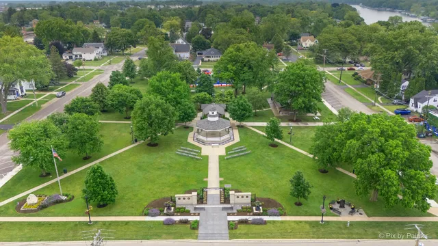 an aerial view of a city with lawn chairs