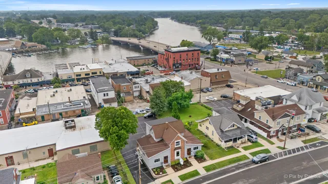 an aerial view of residential houses with outdoor space