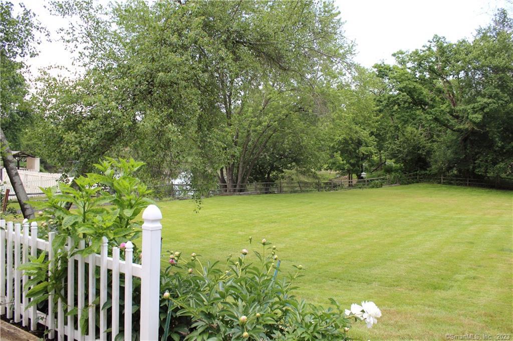 384 Greens Farms Road Westport, CT 06880 - Photo 1 of 1 a view of a yard with a tree