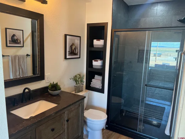 a bedroom with a bed and a washing machine