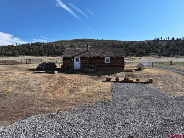 a view of a backyard with sitting area