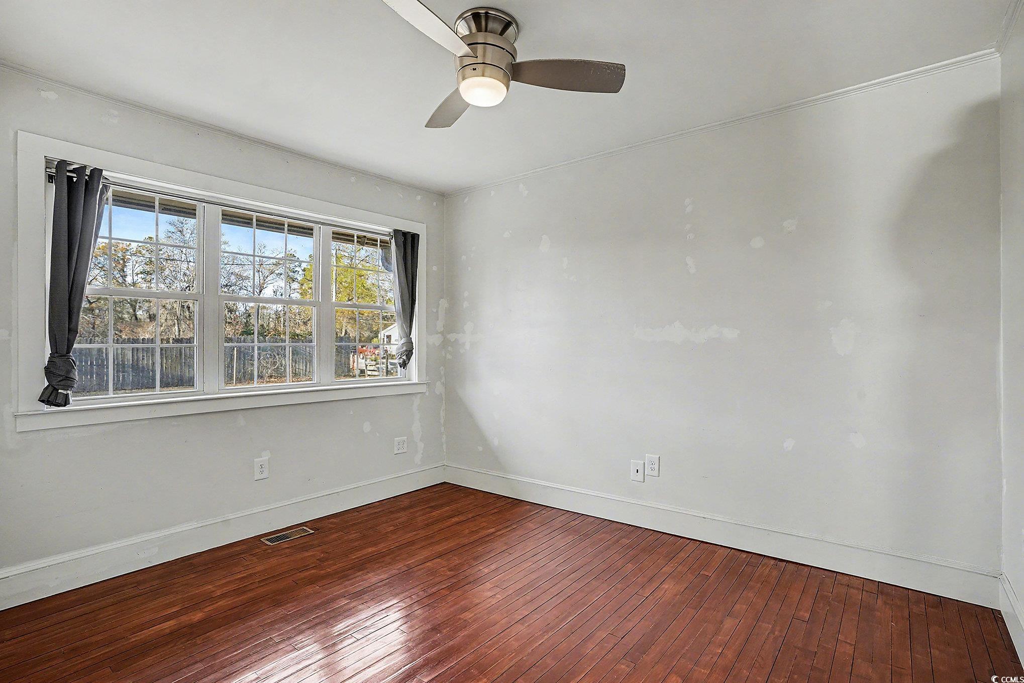 218 Busbee Street Conway, SC 29526 - Photo 18 of 30 Spare room with dark wood-style flooring and ceiling fan