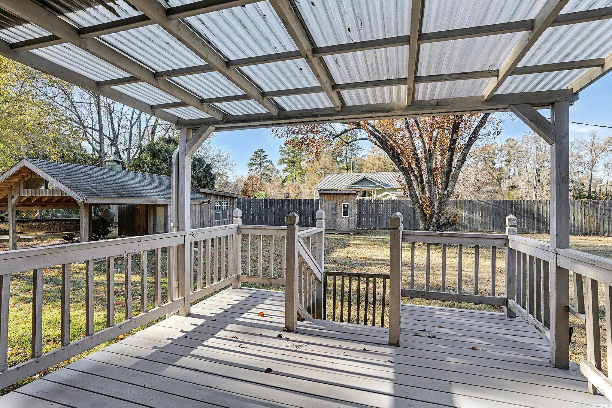 218 Busbee Street Conway, SC 29526 - Photo 25 of 30 Wooden deck with a fenced backyard and an outbuilding