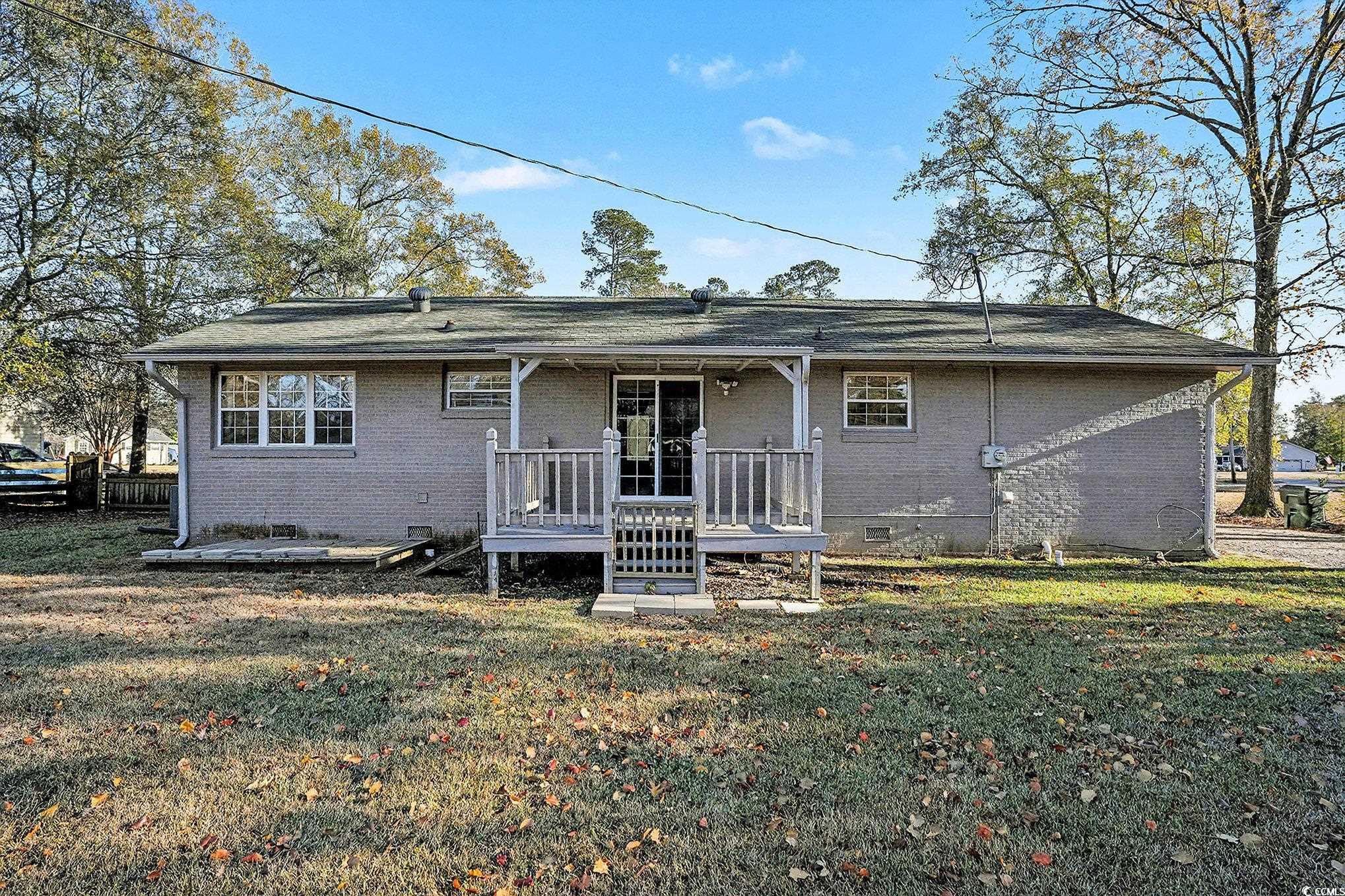 218 Busbee Street Conway, SC 29526 - Photo 26 of 30 View of front of property with crawl space, brick siding, a front lawn, and a porch