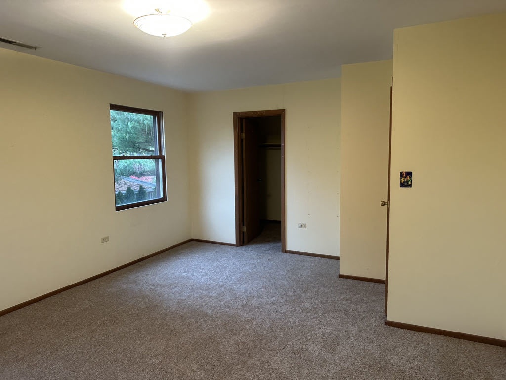 2272 Asbury Road Northbrook, IL 60062 - Photo 13 of 22 an empty room with windows