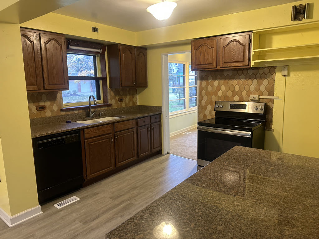2272 Asbury Road Northbrook, IL 60062 - Photo 5 of 22 a kitchen with cabinets and wooden floor