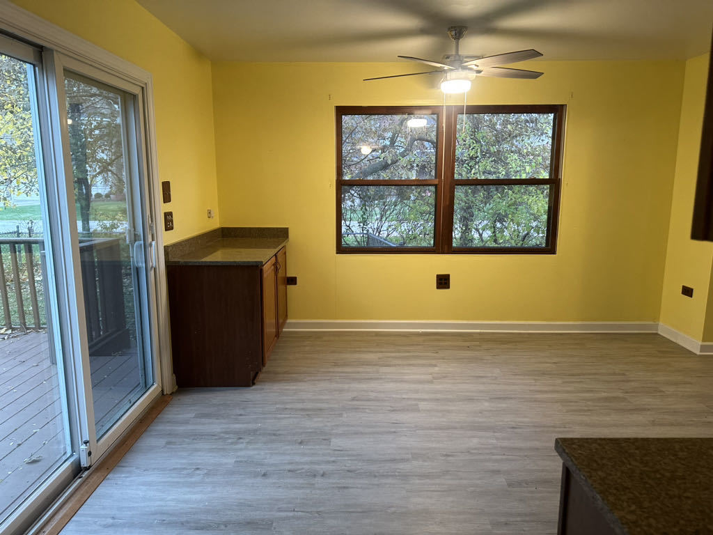 2272 Asbury Road Northbrook, IL 60062 - Photo 6 of 22 a view of an empty room with wooden floor and a window