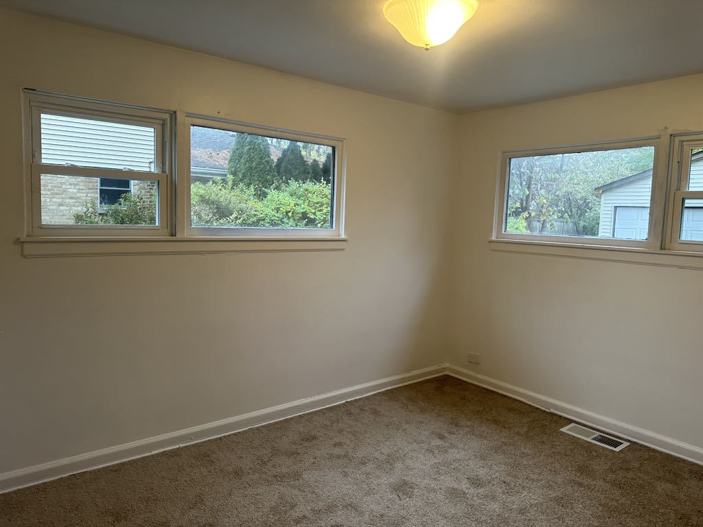 2272 Asbury Road Northbrook, IL 60062 - Photo 10 of 22 an empty room with a window