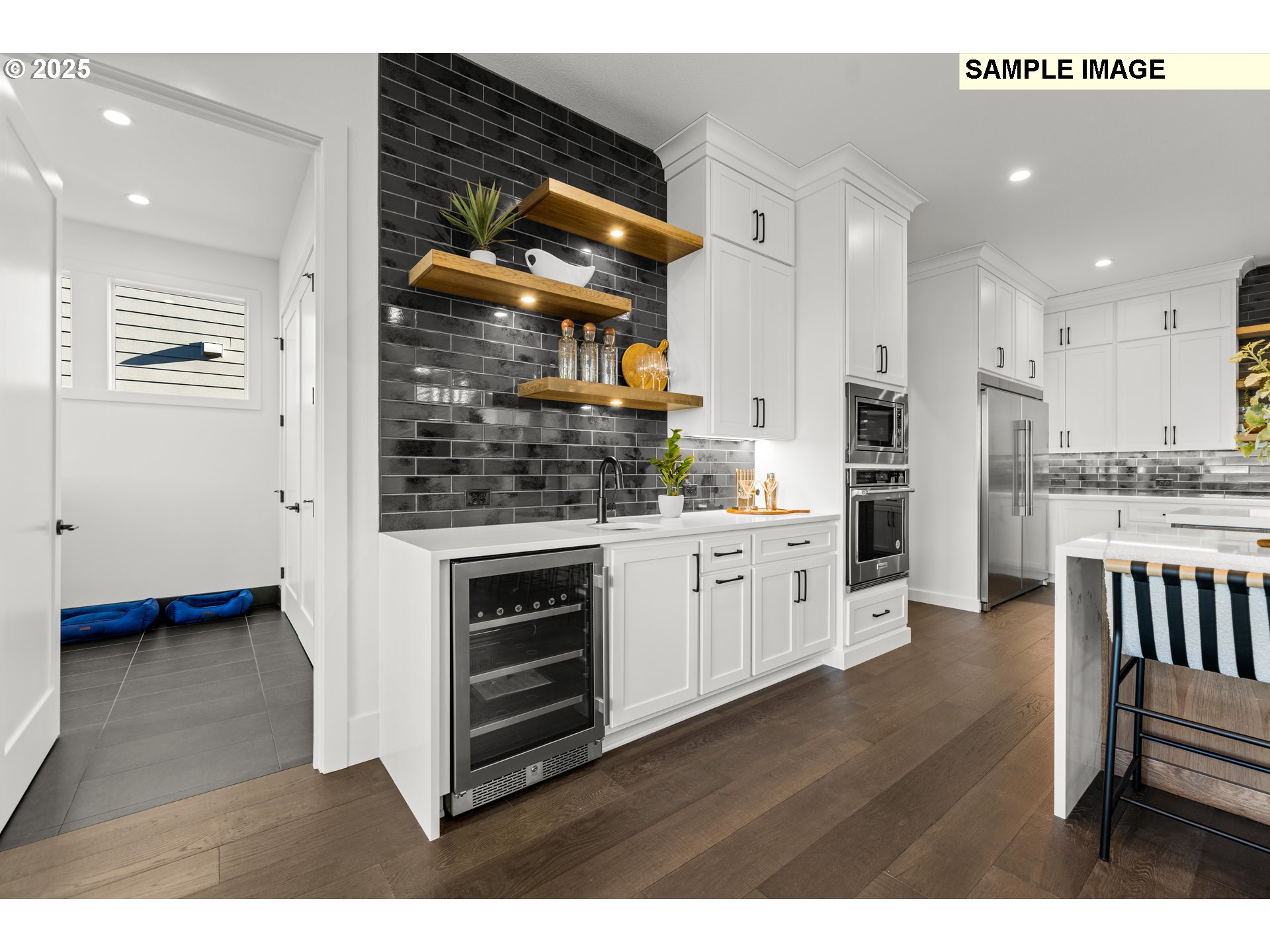 2003 Northwest 121st Street Vancouver, WA 98685 - Photo 17 of 48 a kitchen with stainless steel appliances kitchen island granite countertop a refrigerator and a stove top oven
