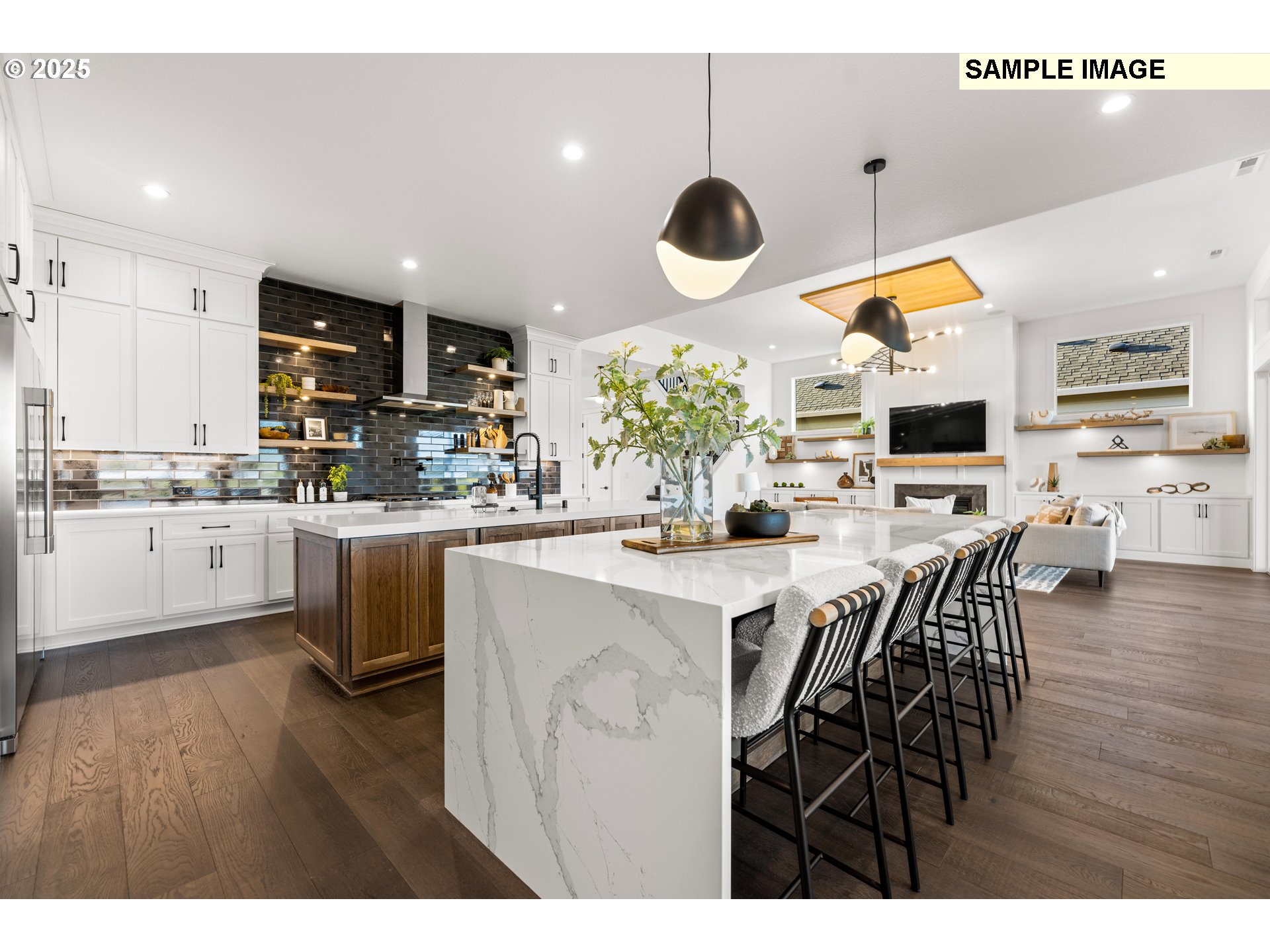 2003 Northwest 121st Street Vancouver, WA 98685 - Photo 20 of 48 a kitchen with stainless steel appliances kitchen island granite countertop a stove top oven a sink a dining table and chairs with wooden floor