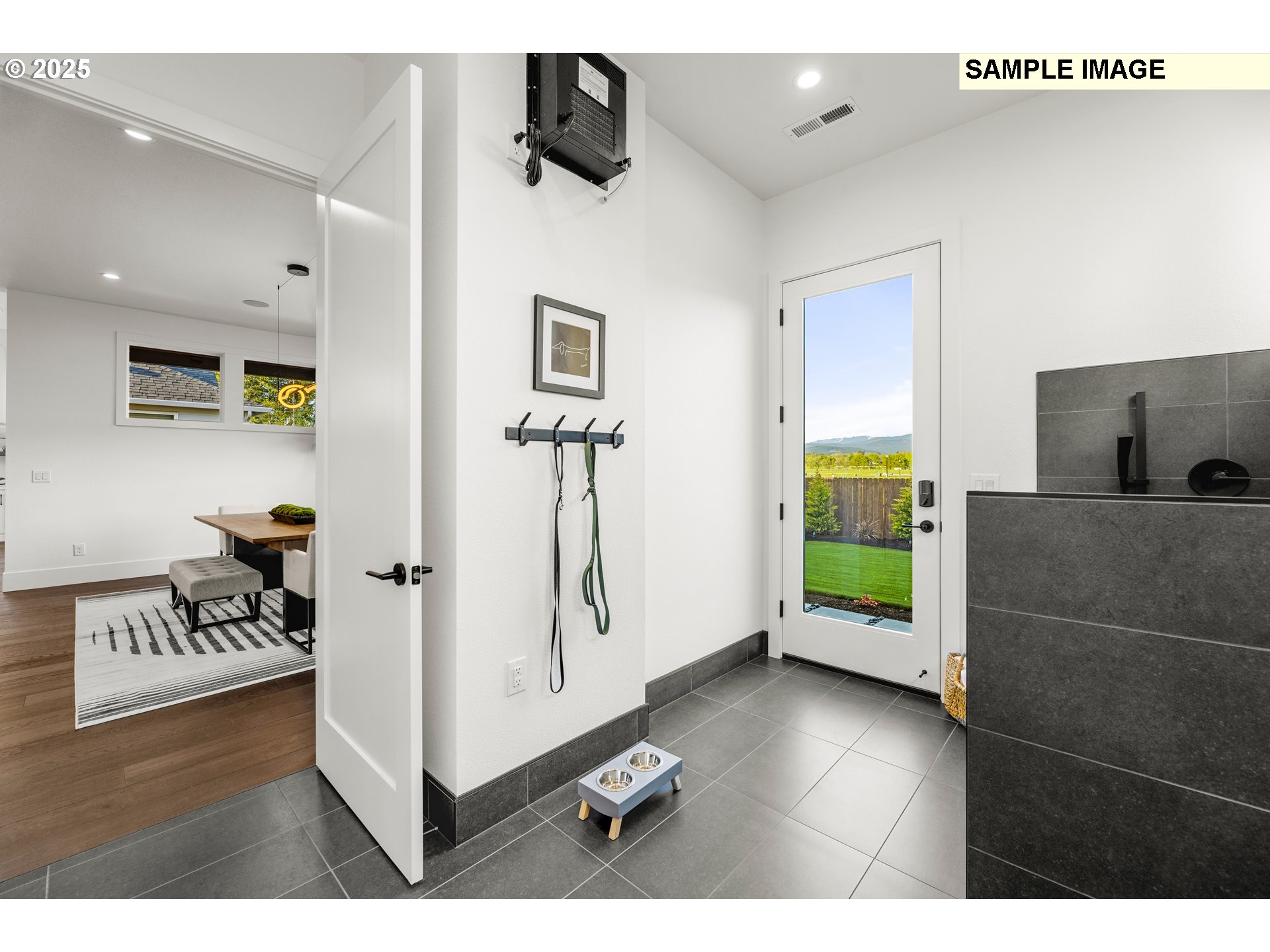 2003 Northwest 121st Street Vancouver, WA 98685 - Photo 29 of 48 a living room with furniture and a flat screen tv