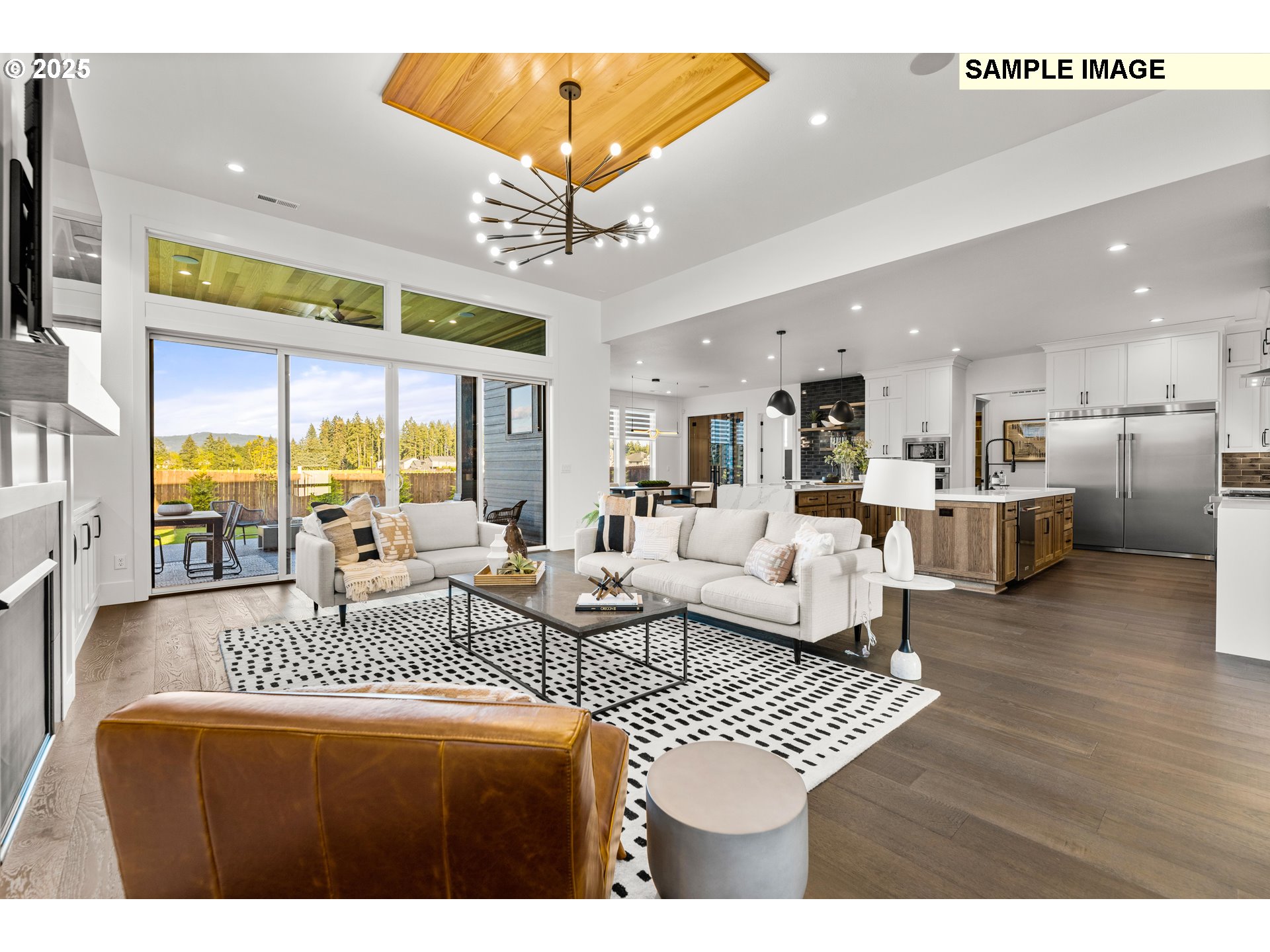 2003 Northwest 121st Street Vancouver, WA 98685 - Photo 10 of 48 a living room with furniture a chandelier and a dining table