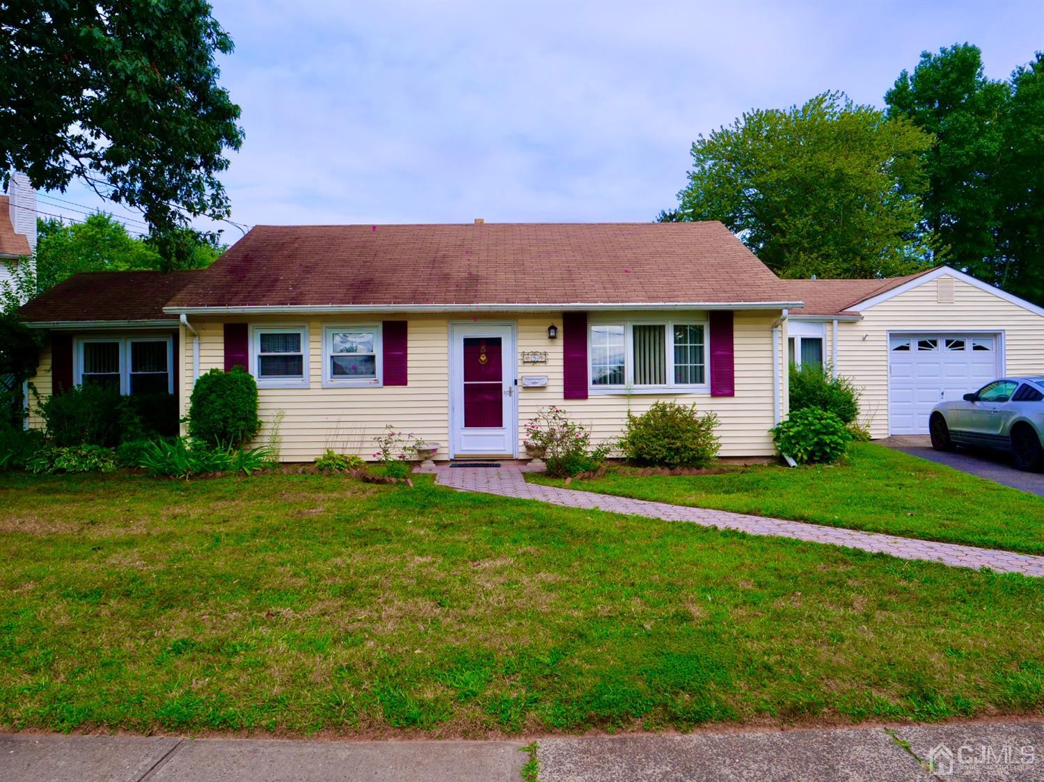 5 Idlewild Road Edison, NJ 08817 - Photo 1 of 13 a front view of a house with a yard
